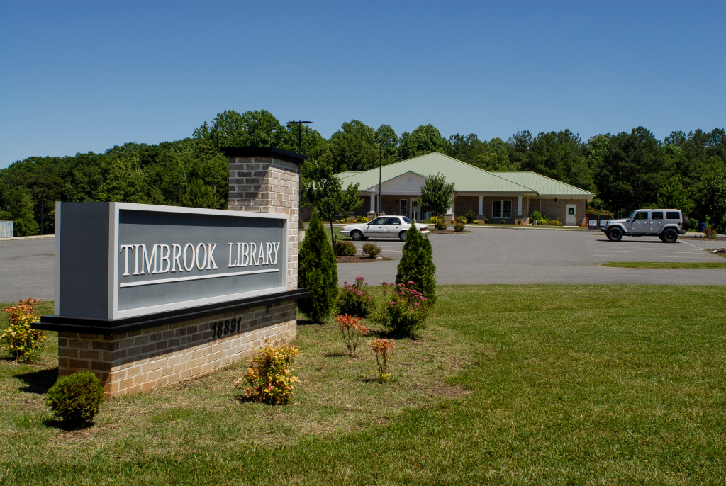 View of Timbrook Library and sign from roadside.